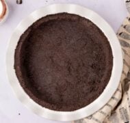 oreo pie crust in pie tin top view.