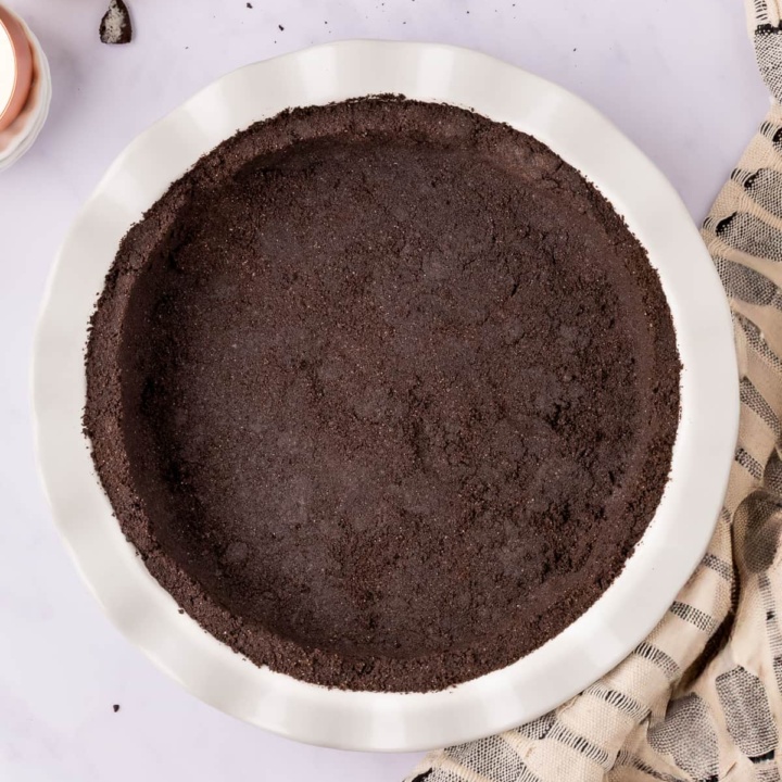 oreo pie crust in pie tin top view.