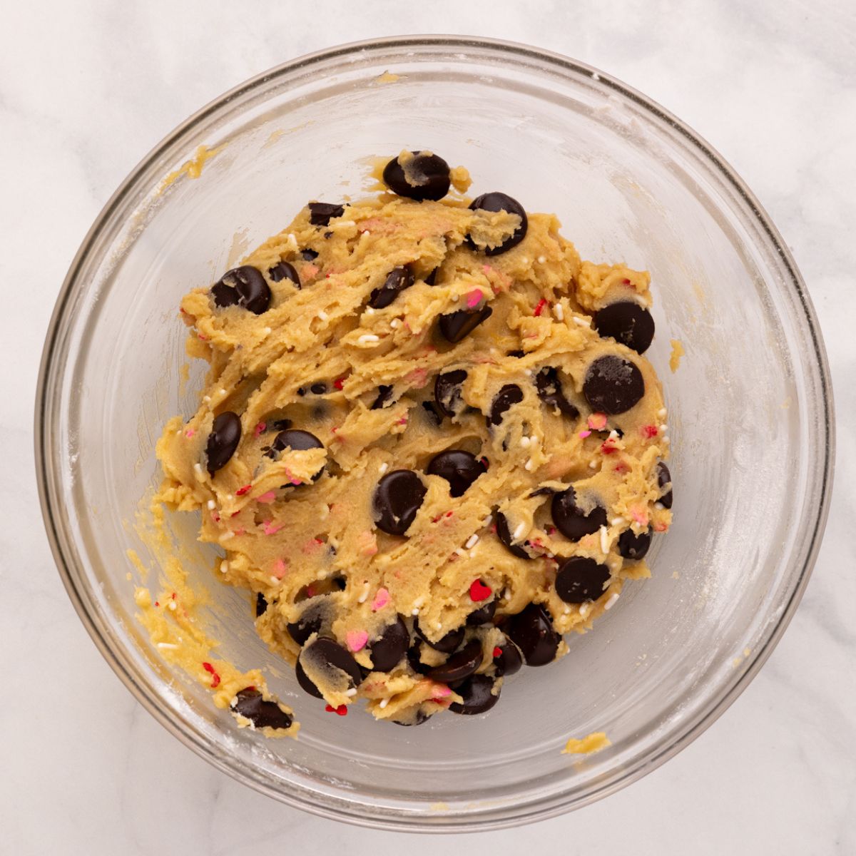 cookie dough with sprinkles and chocolate chips mixed in.