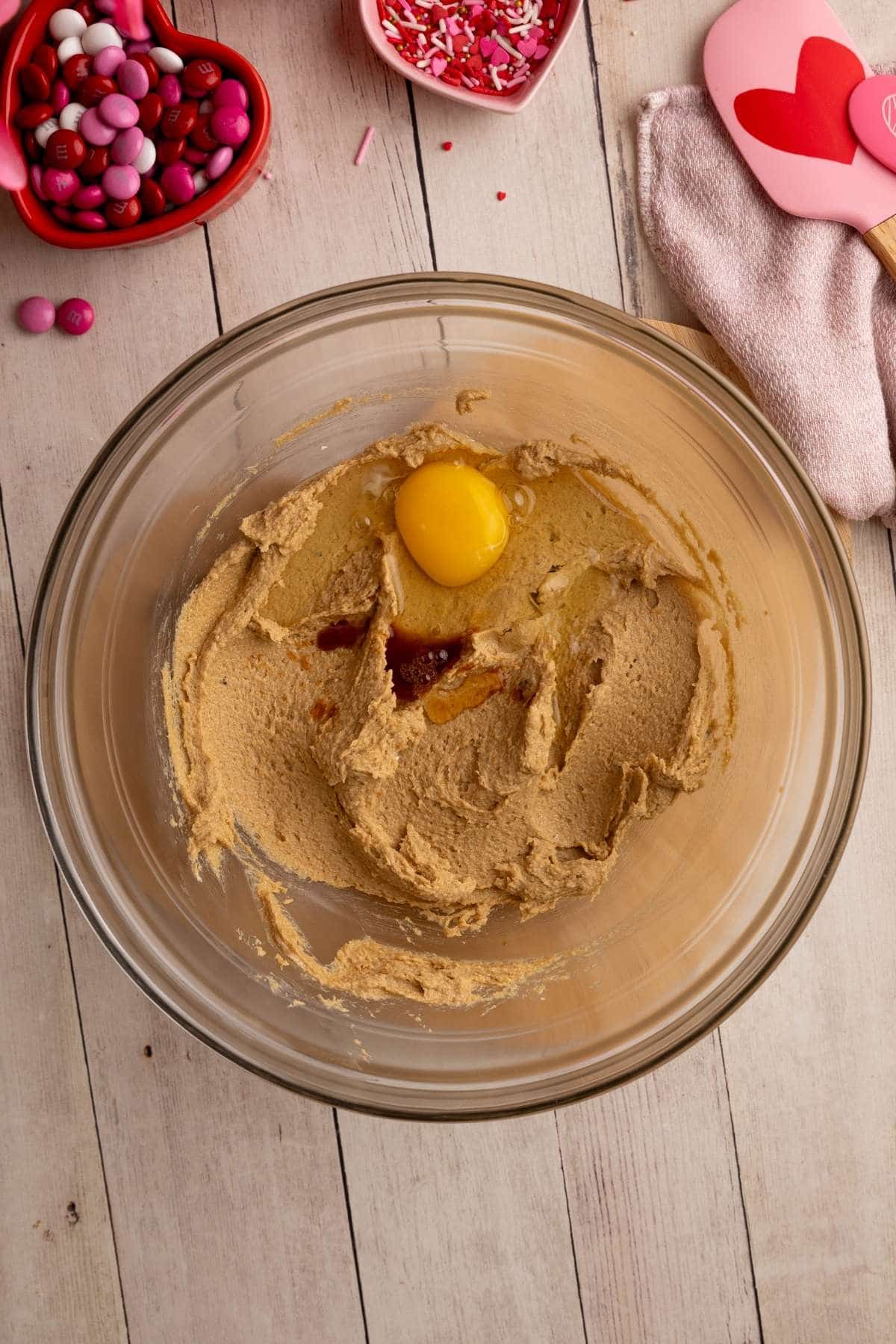 unmixed egg and vanilla in the cookie dough.