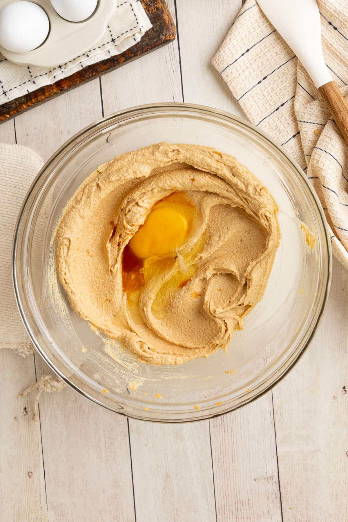 egg and vanilla in bowl of creamed butter, peanut butter and sugar.