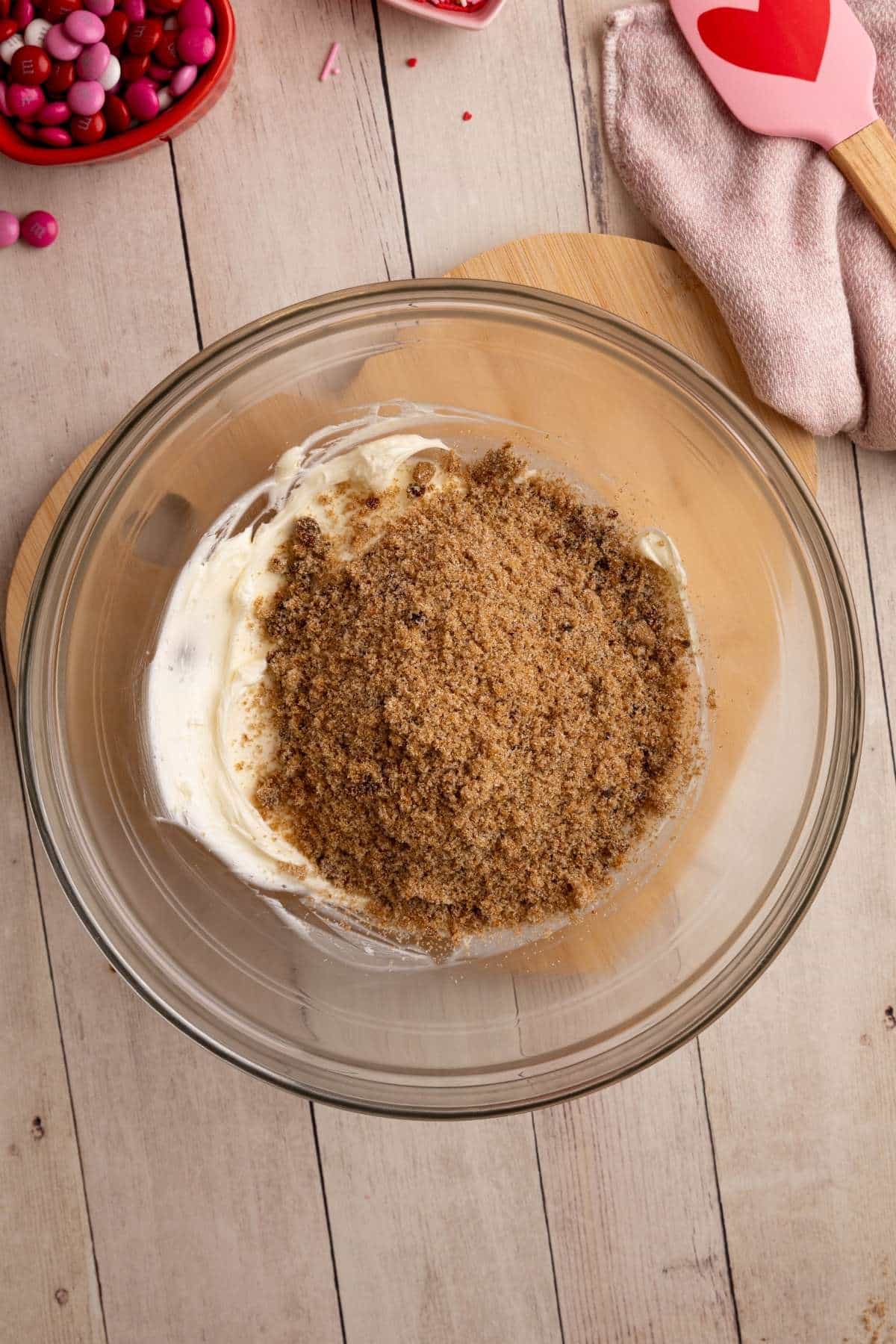 adding the sugar mixture to the creamed butter, but not yet mixed together.