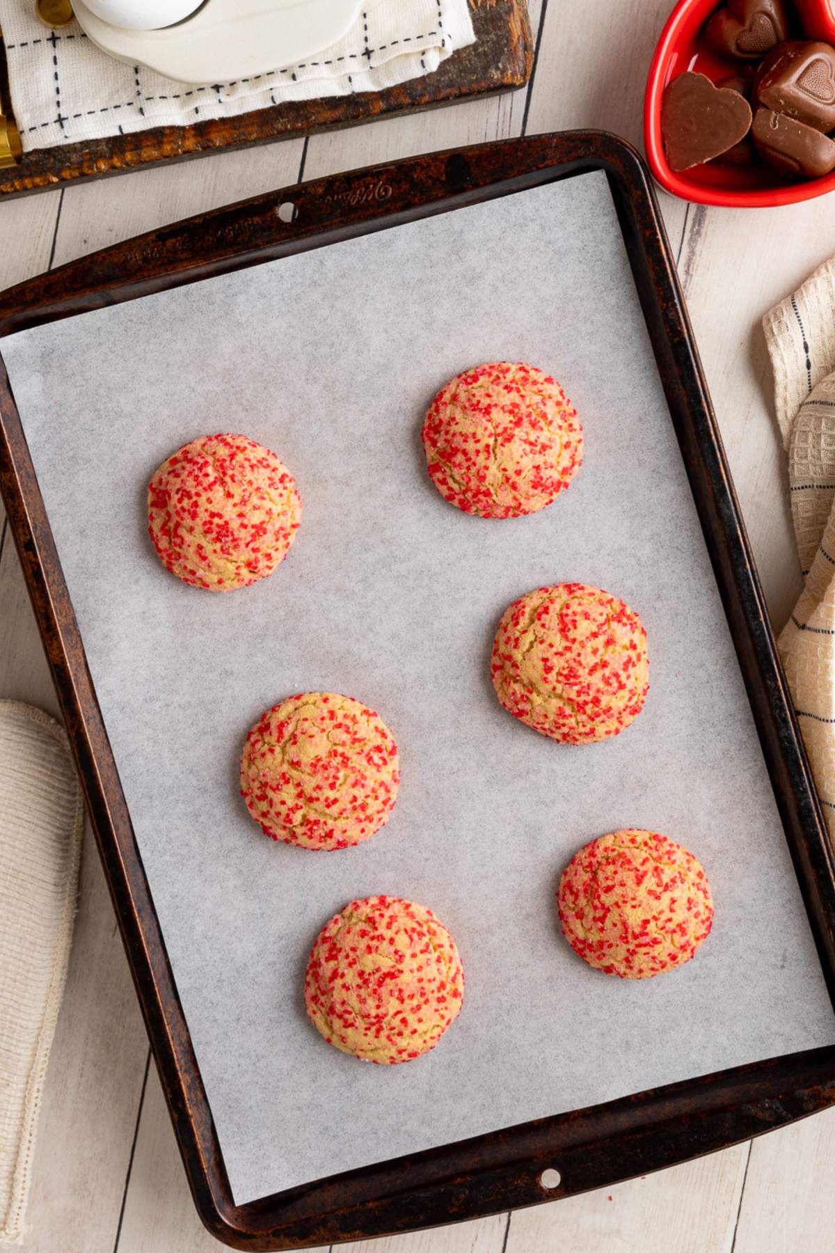 baked cookies on brown metal baking sheet.