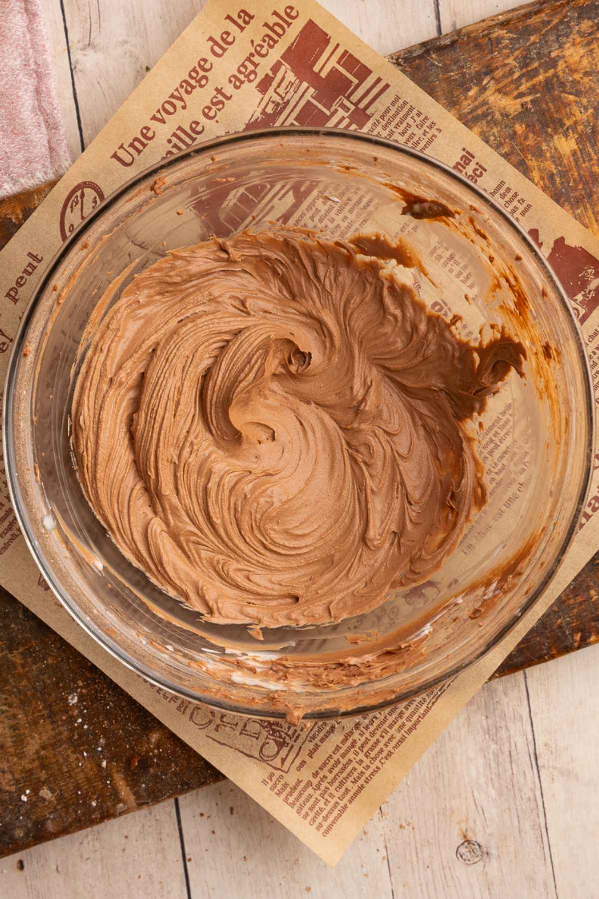 glas bowl with cream cheese, powdered sugar, and cocoa powder mixed until smooth and creamy.