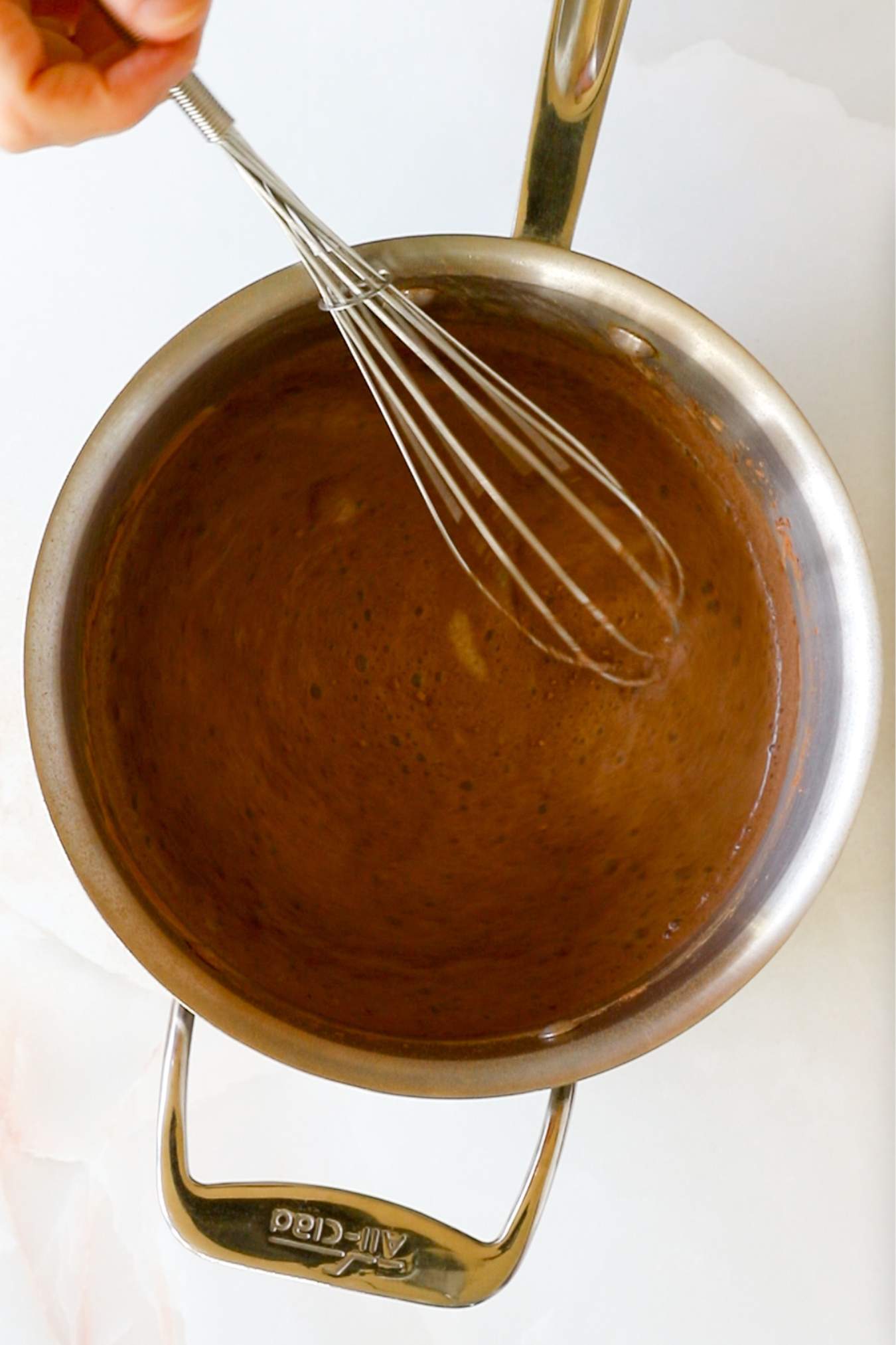 mixing all ingredients in a metal saucepan with a whisk.