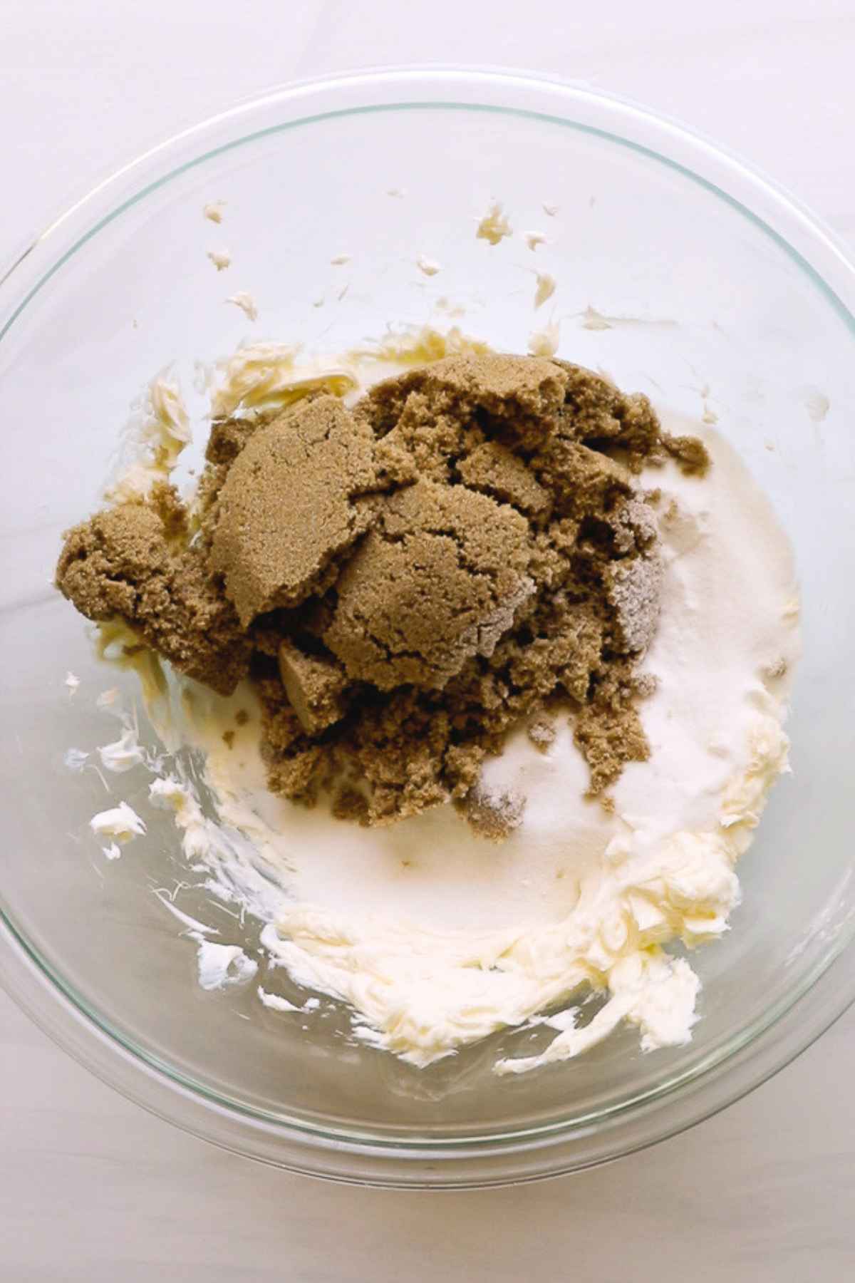 sugars and butter for cookies in glass bowl.