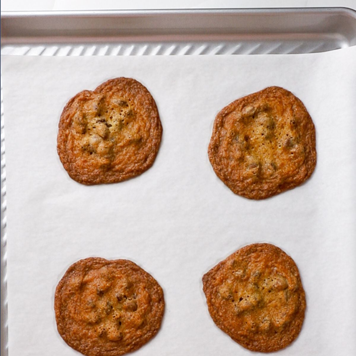 baked cookies on parchment lined cookie sheet.